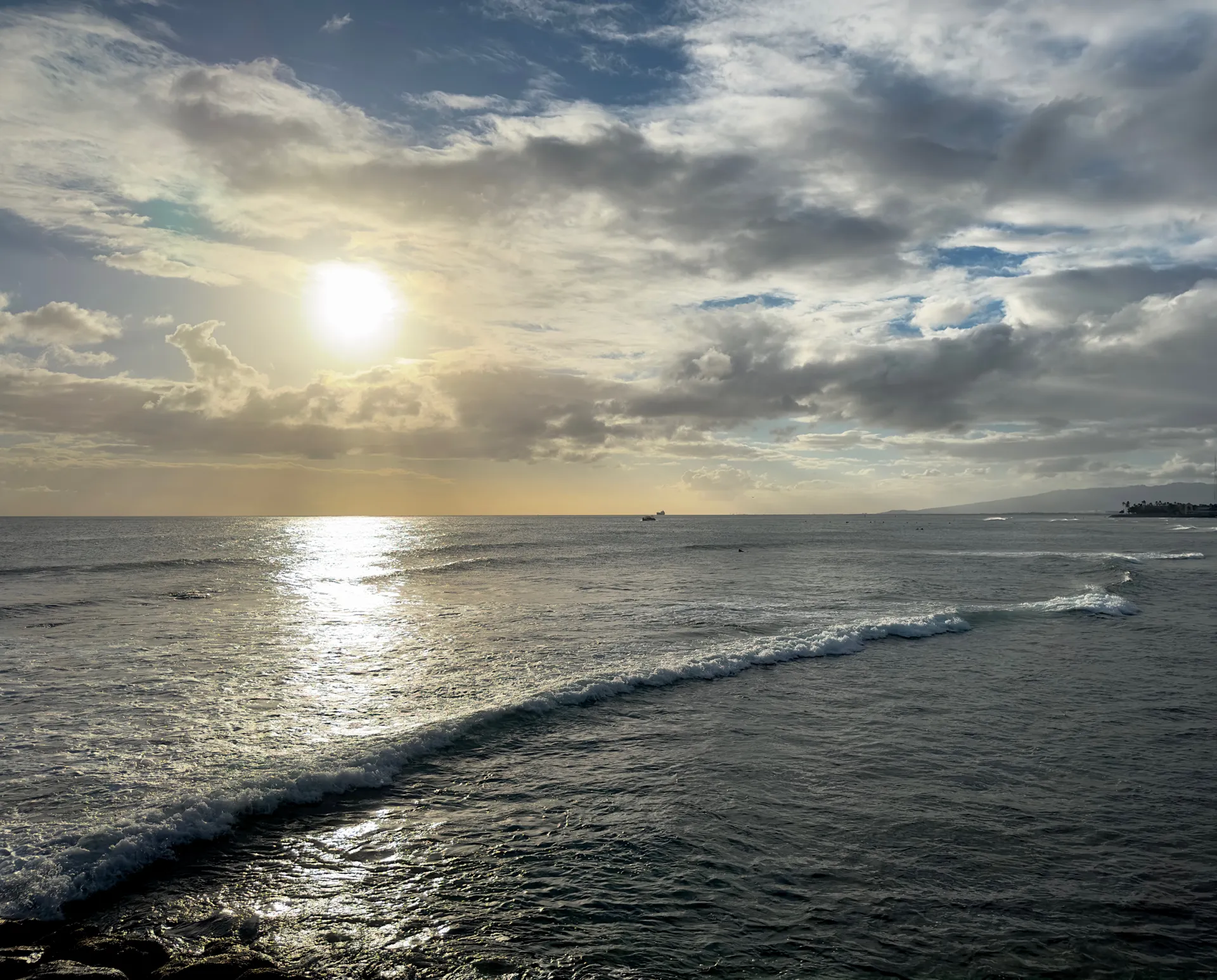 The sun setting over Waikiki Beach