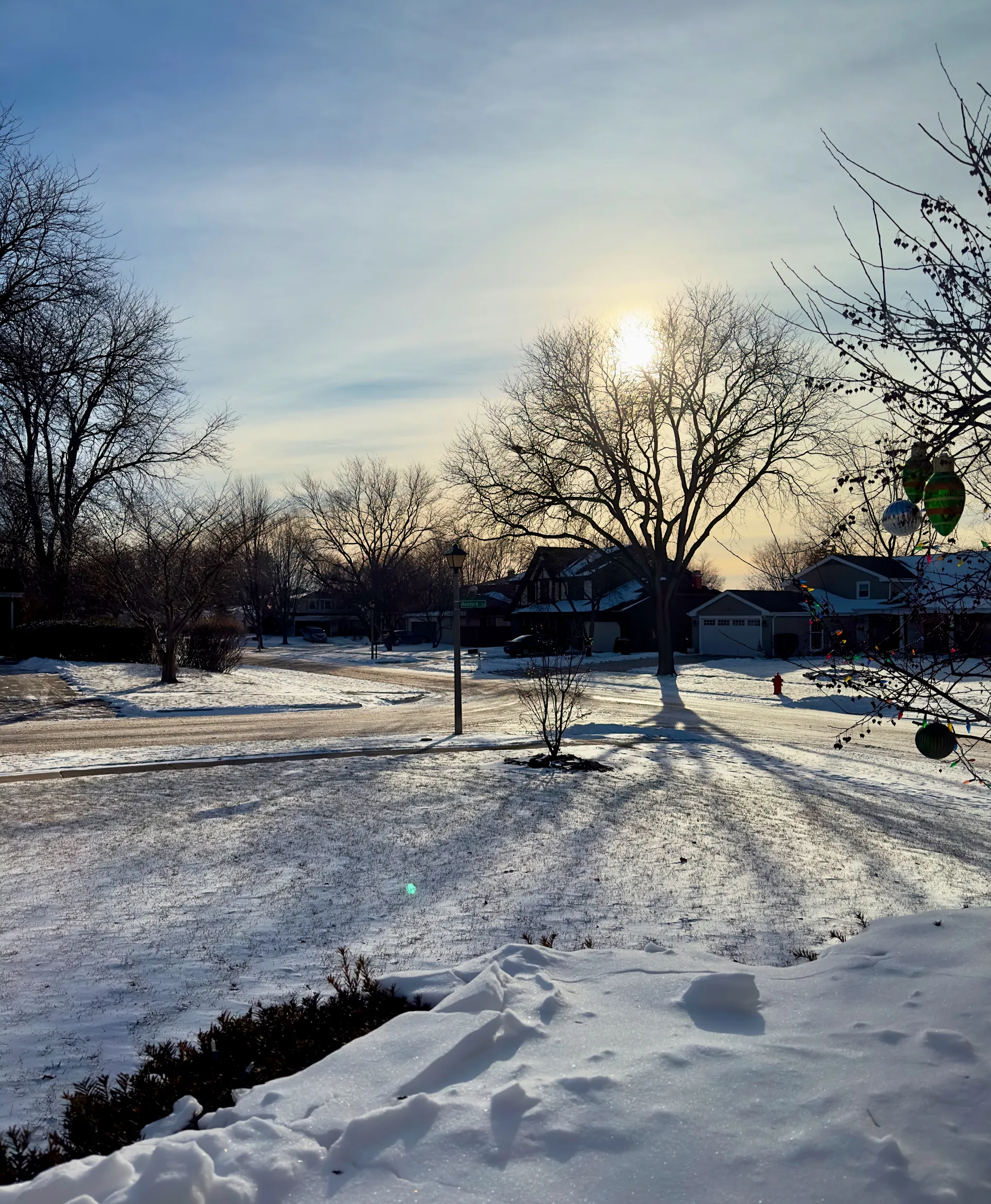 A suburban street covered by snow