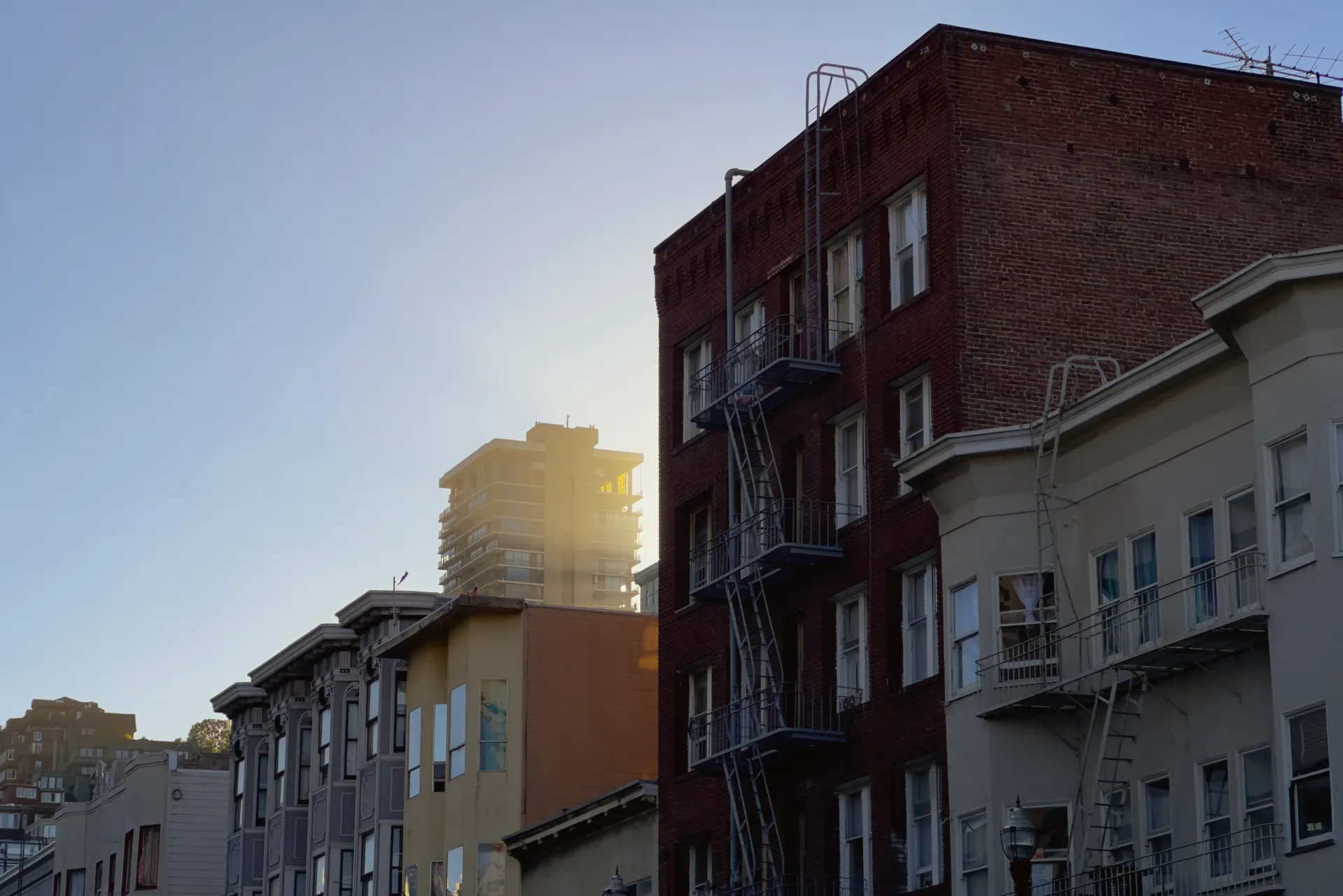 Light shining through buildings in North Beach