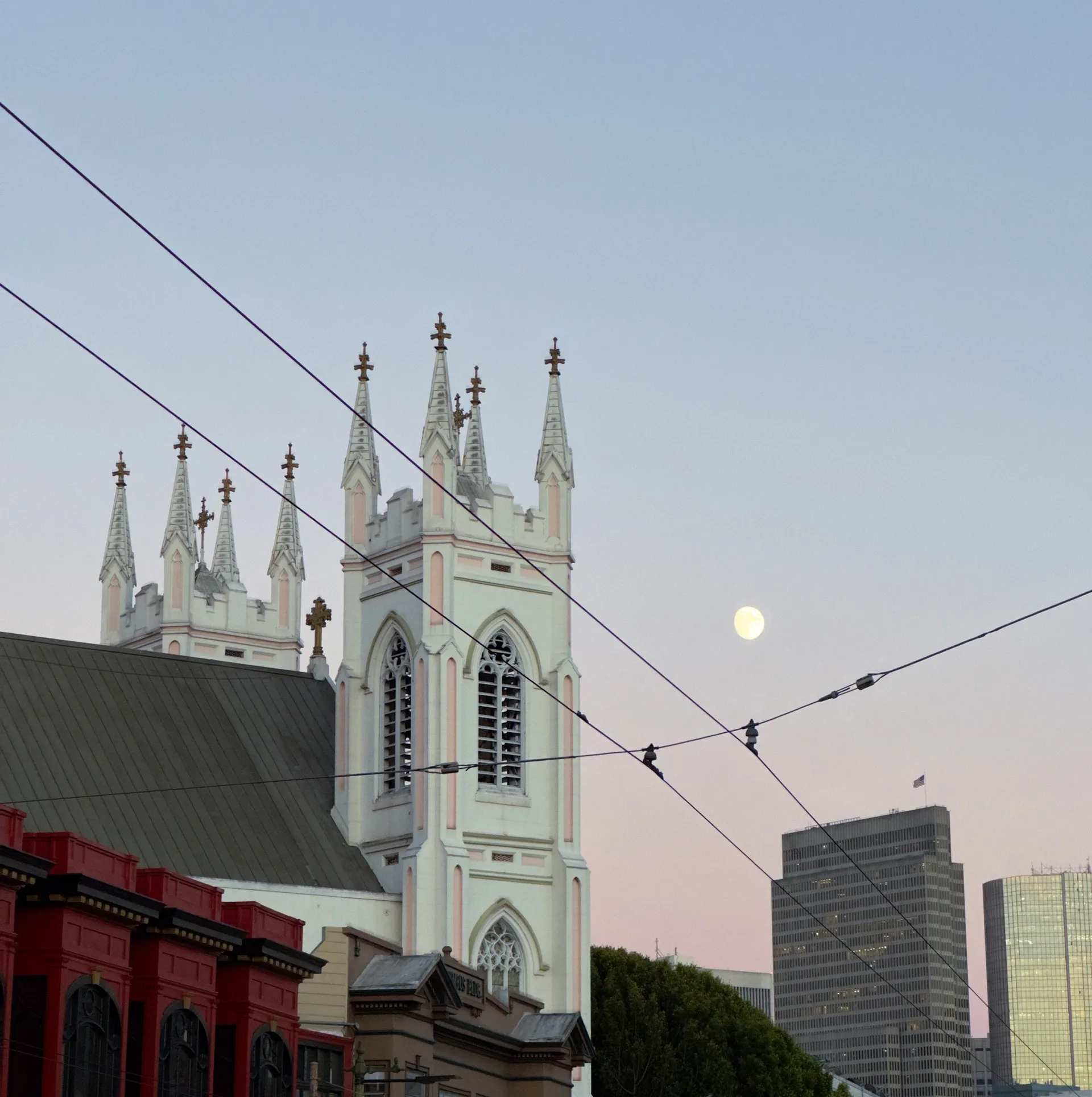 The moon rising over a church in North Beach