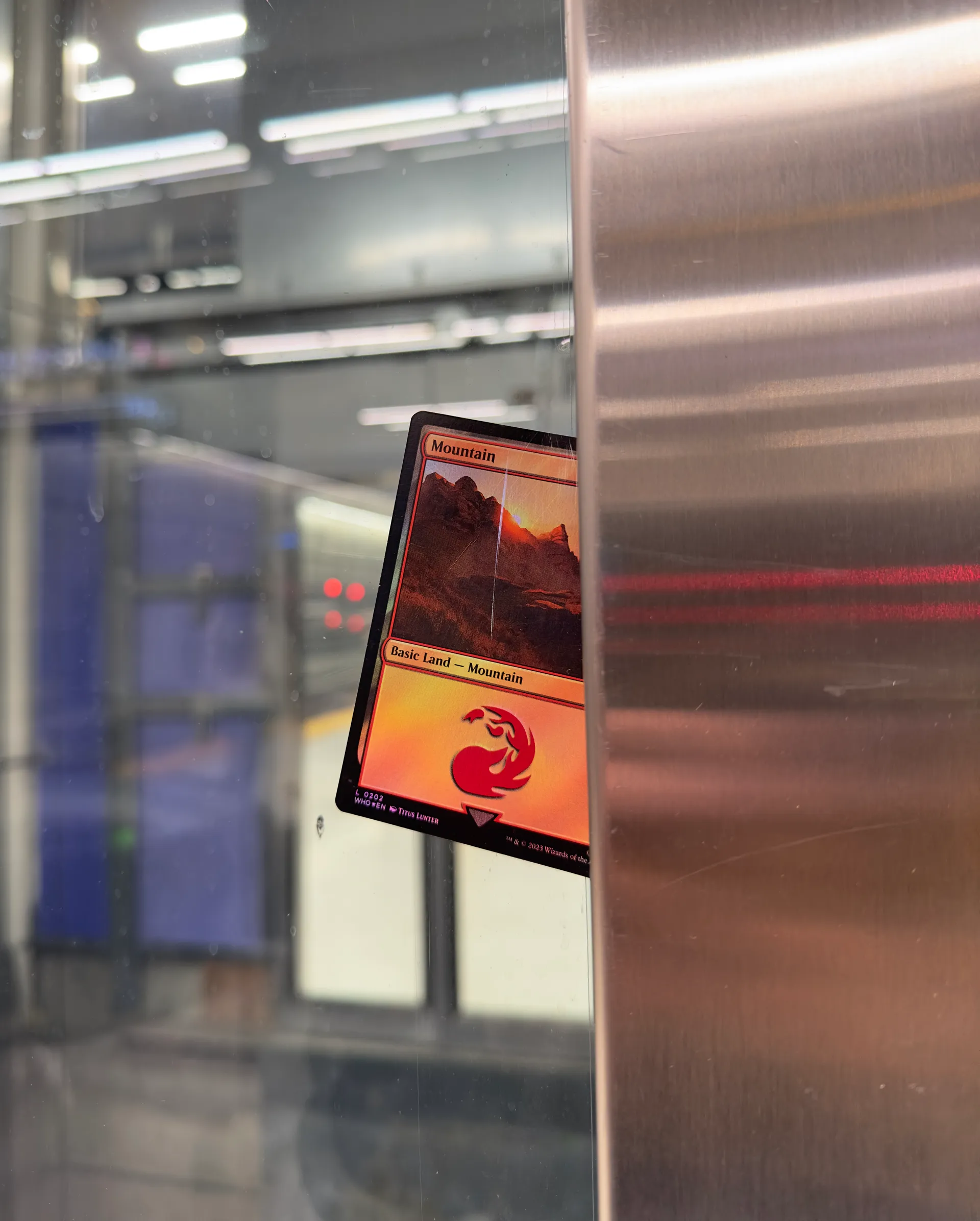 A Magic: The Gathering card stuck in an elevator shaft