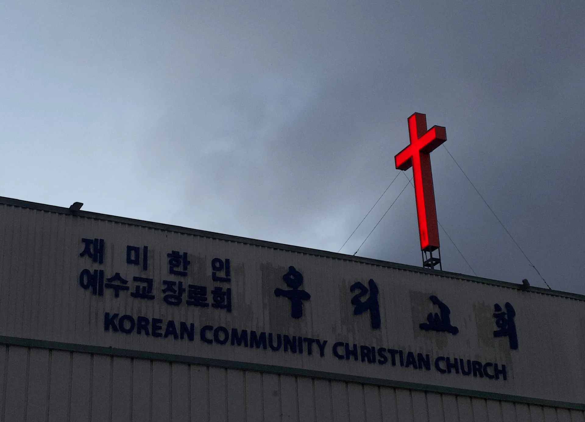 A cross hanging over a Korean church in Oakland