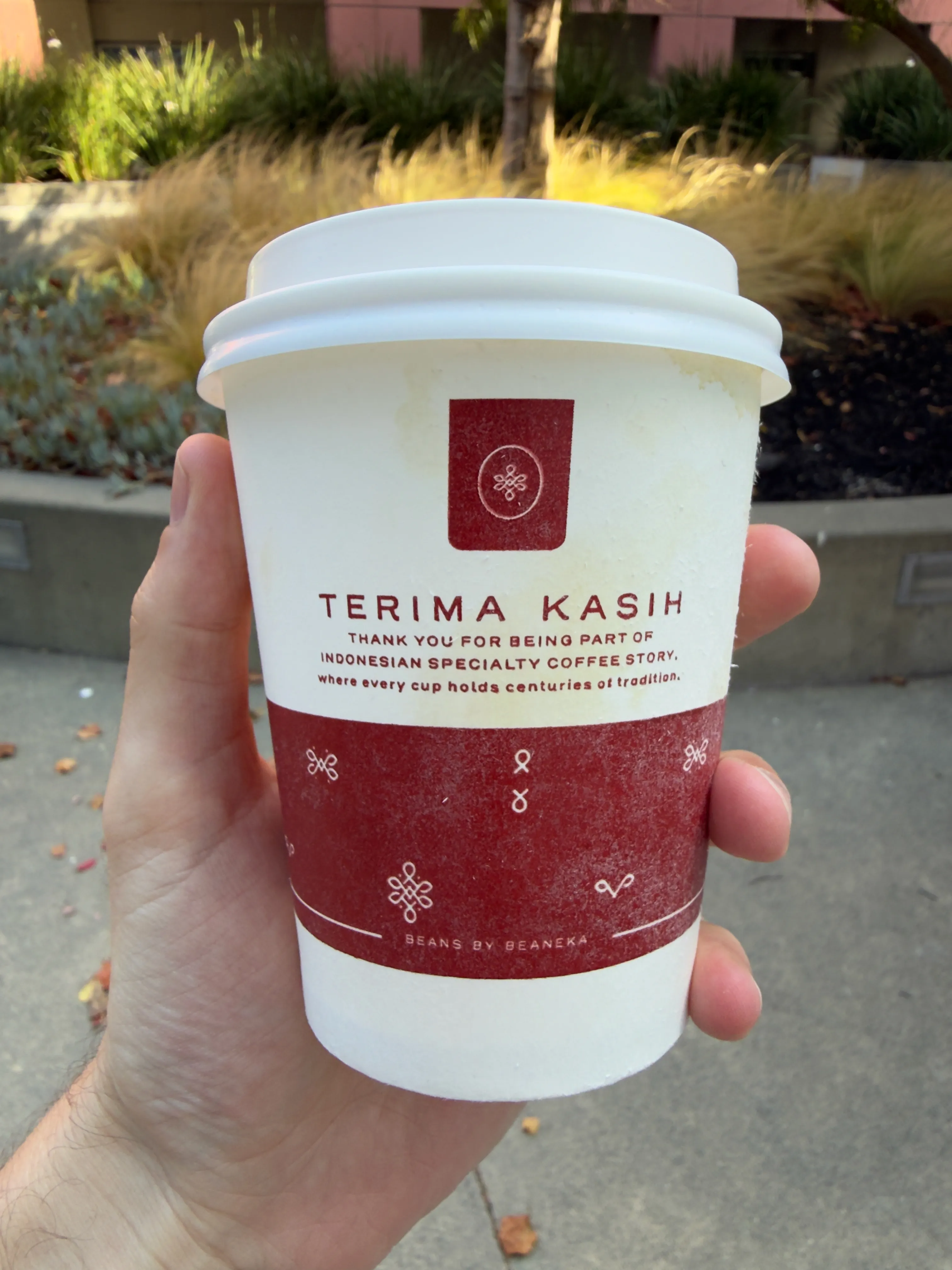 Back side of a coffee cup from Kopiku Coffee, showing a thank you message Back side of a coffee cup from Kopiku Coffee, showing a thank you message