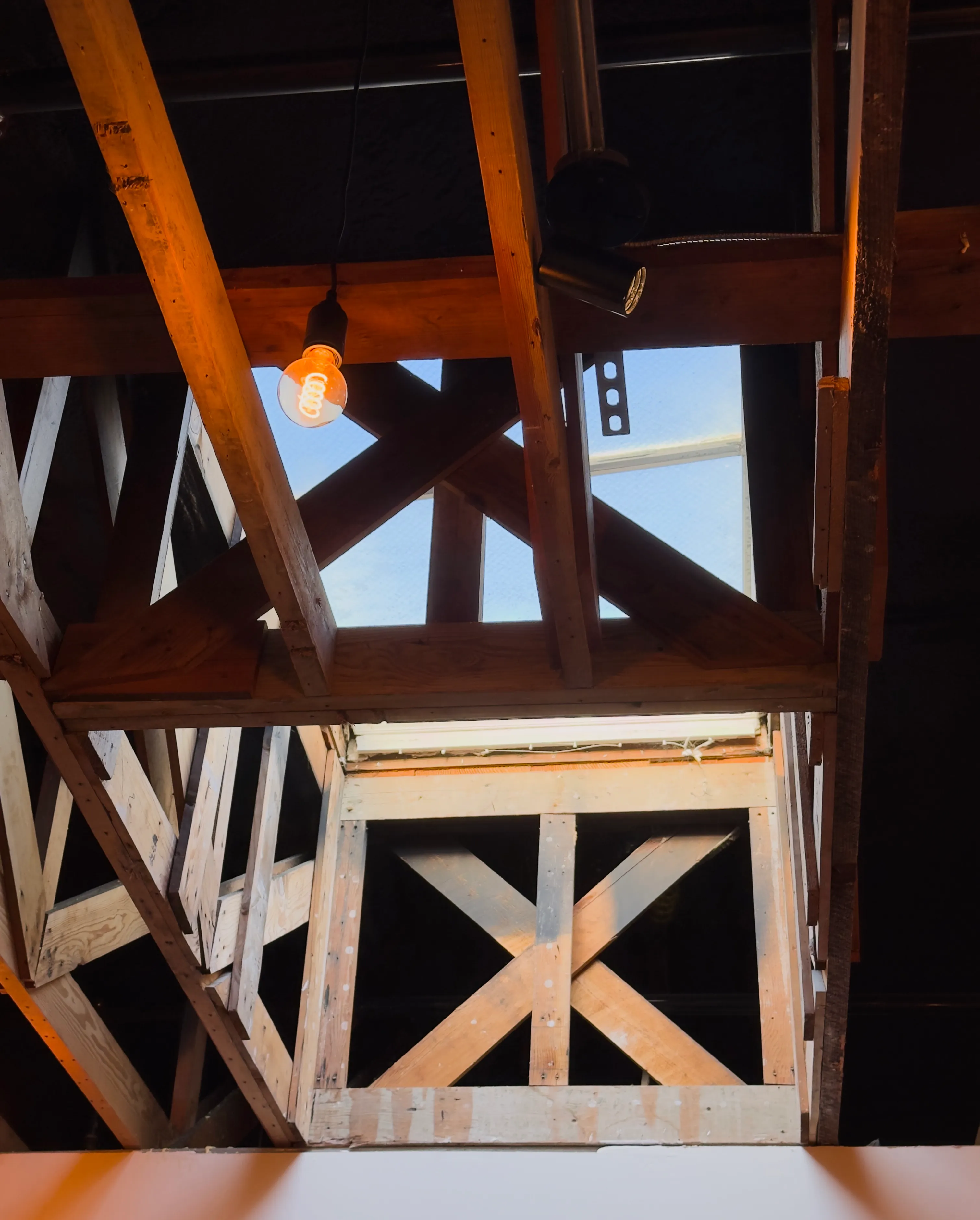 A lightbulb hanging over Maillard's in Outer Sunset