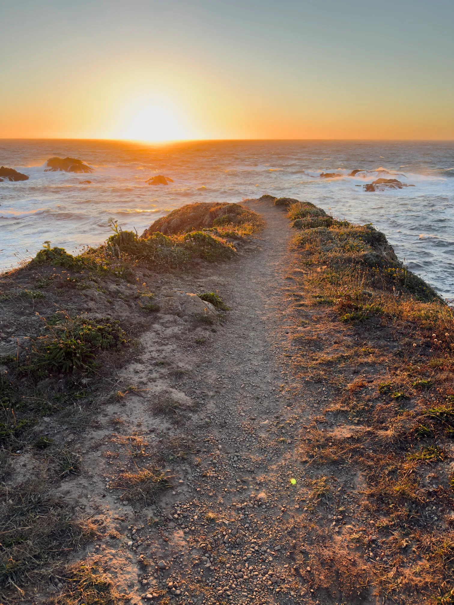 A view of the sunset off a cliff face near Mendocino, CA
