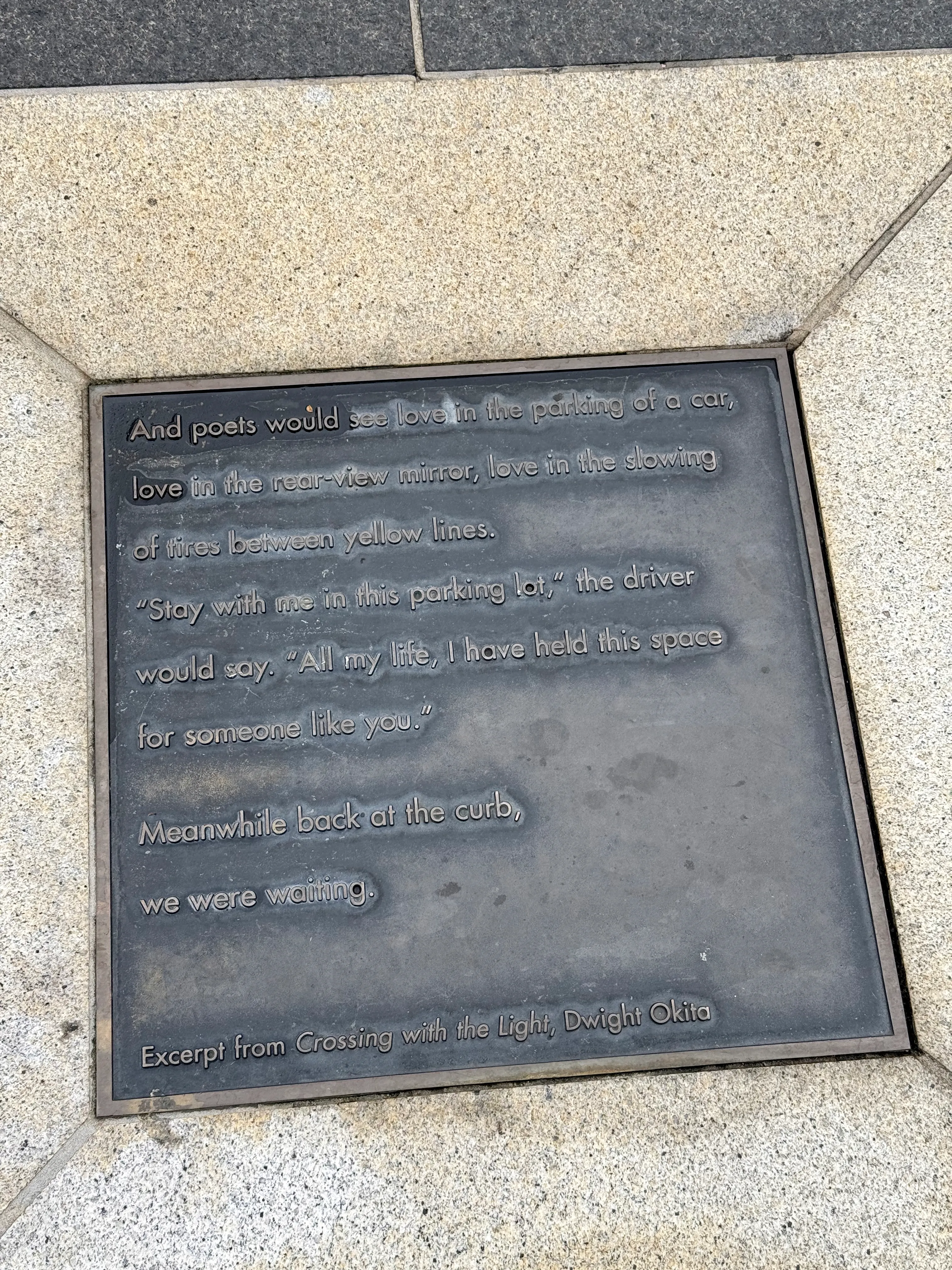 A poem in the ground at at Muni station in San Francisco
