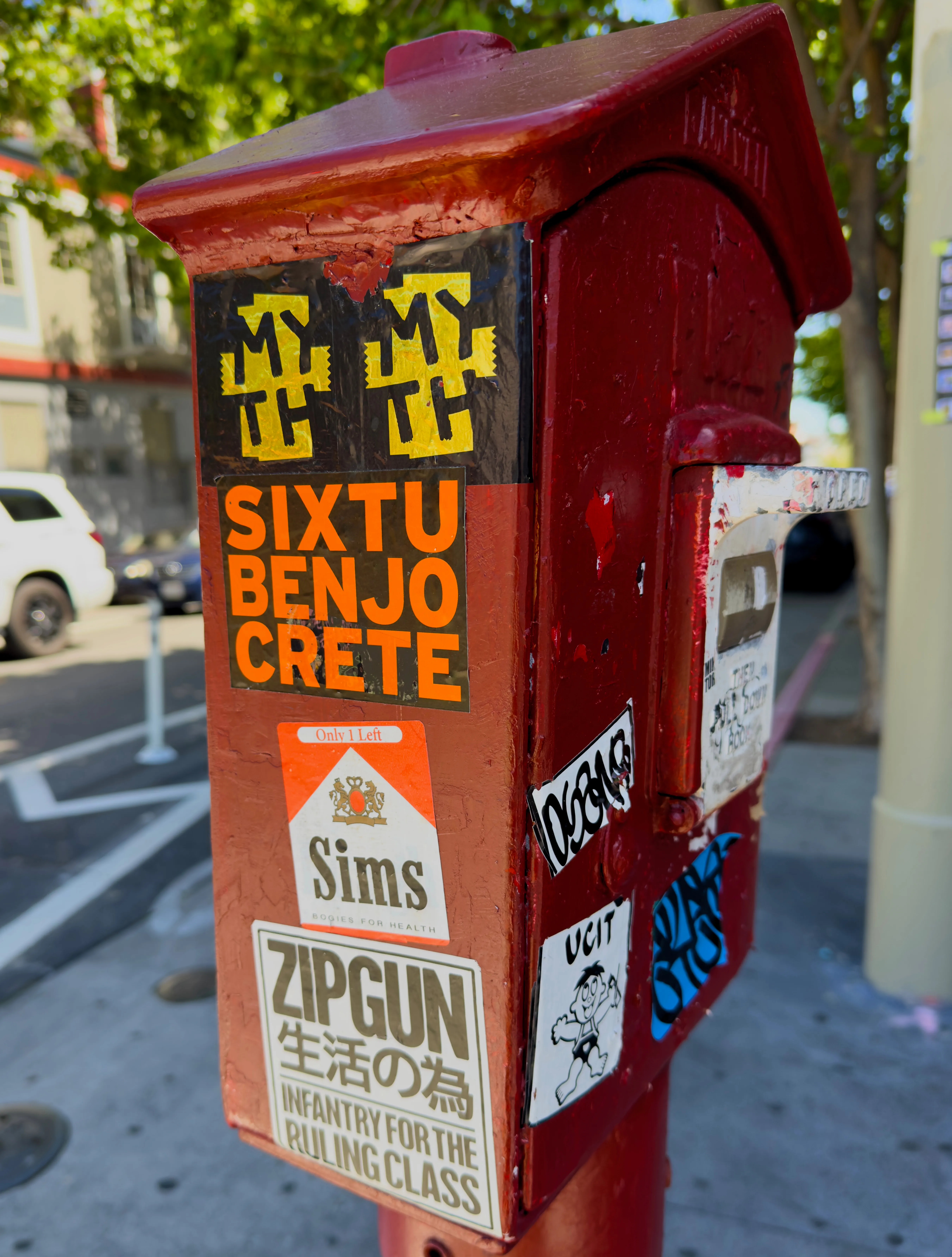 A set of stickers on a ... postbox? ... in the Mission