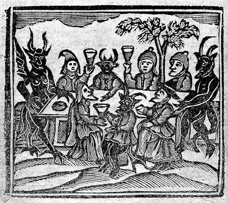 A woodcut of witches feasting with devils